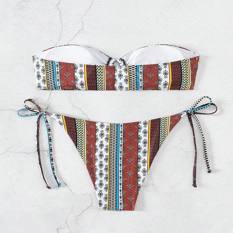 Women's printed lace-up split swimsuit in mixed colours, showing sleeveless one-piece design.