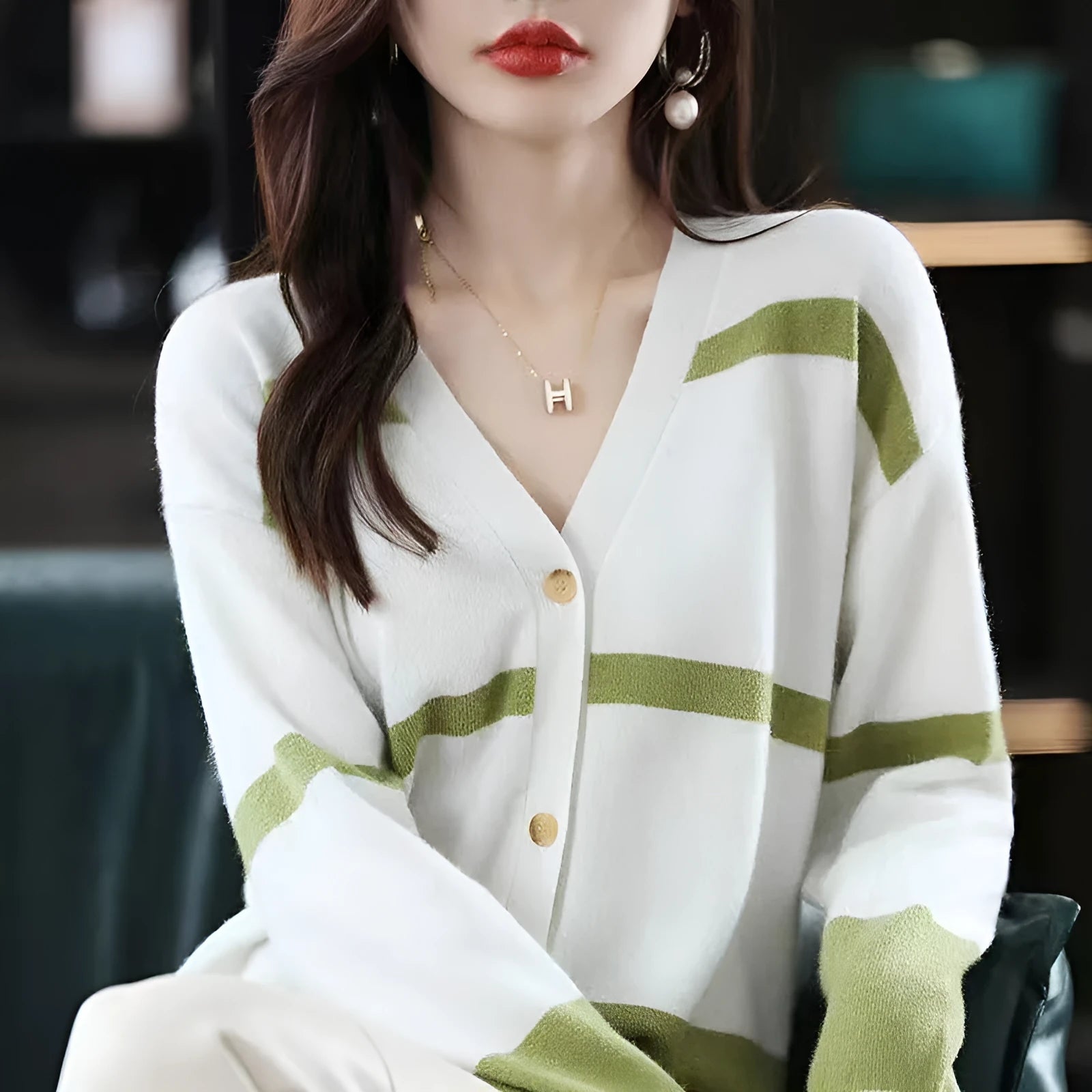Women's slim fit V-neck cardigan with a raised 3D striped knit pattern in black and white.