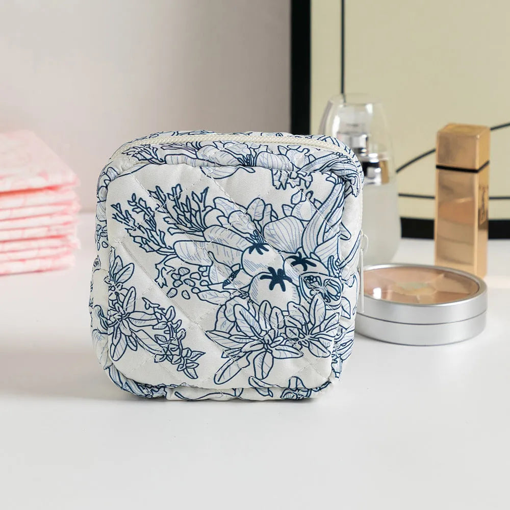 Floral pattern key storage bag made from breathable polyester fabric in various colour options.