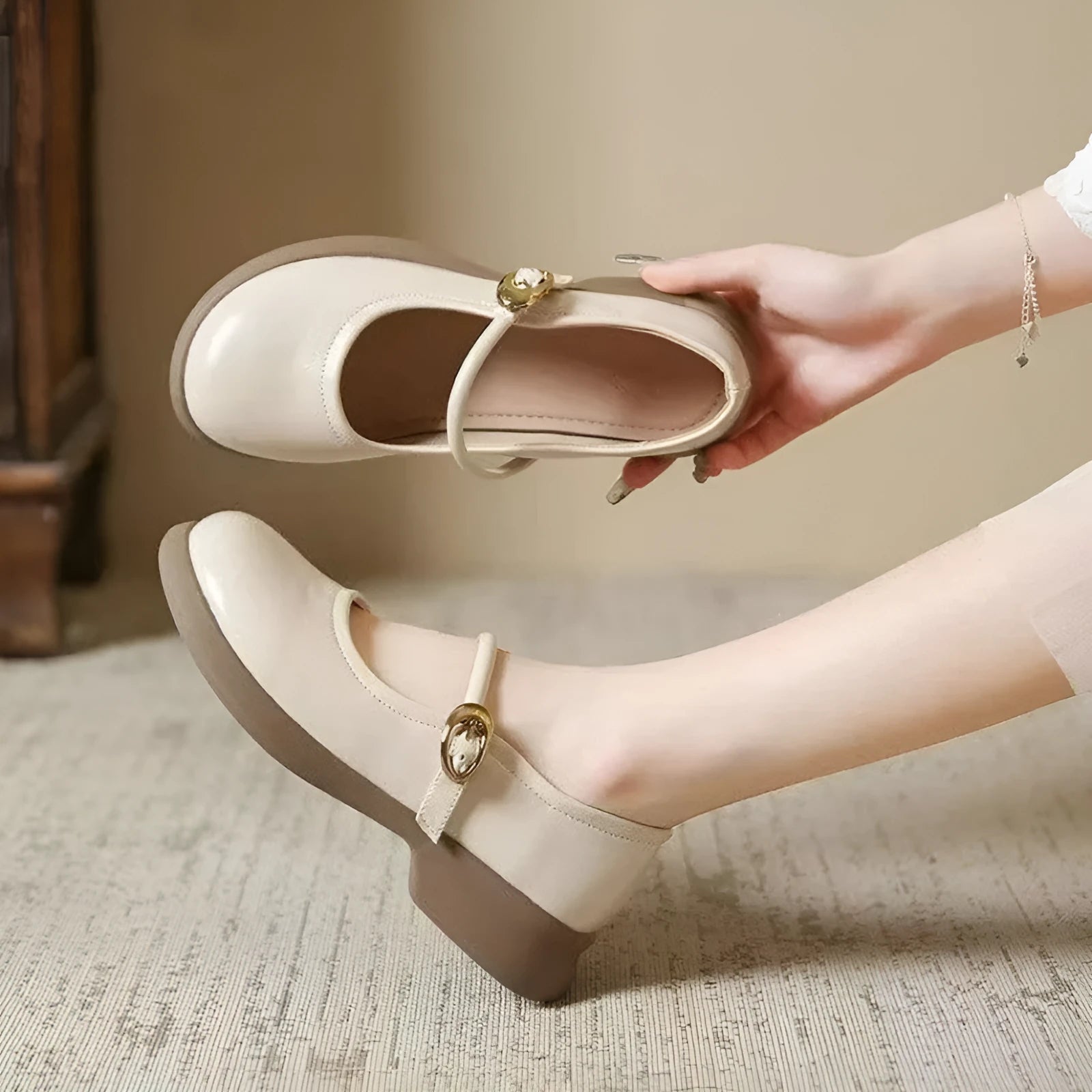 Flat fairy style leather shoes with wedge heel and round toe in black, white, and light brown colours.