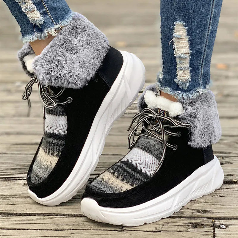 Beige women's mid-top suede snow boots with lace-up front and a thick rubber sole.