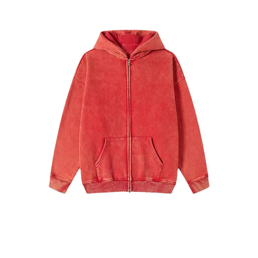 Man wearing a vintage washed cotton hooded cardigan with a fleece lining and double zipper.