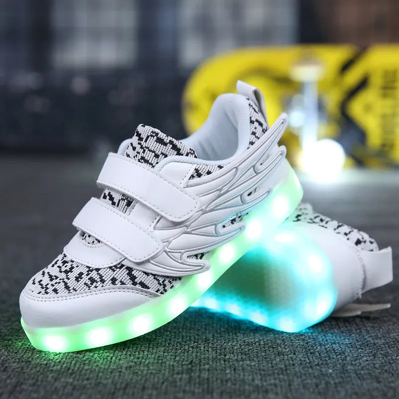 Children's plum red and white LED light-up sneakers with USB charging port on the side.