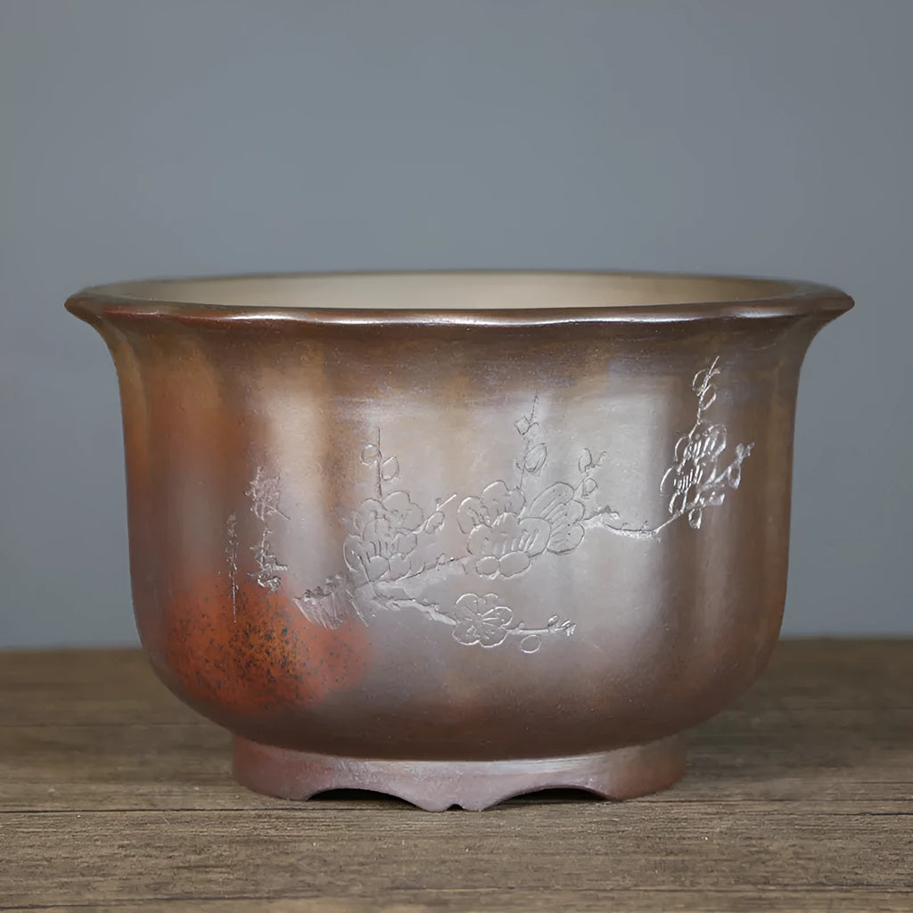 Indoor antique carved ceramic flowerpot in purple sand with a wood-burning finish, shown in large size.