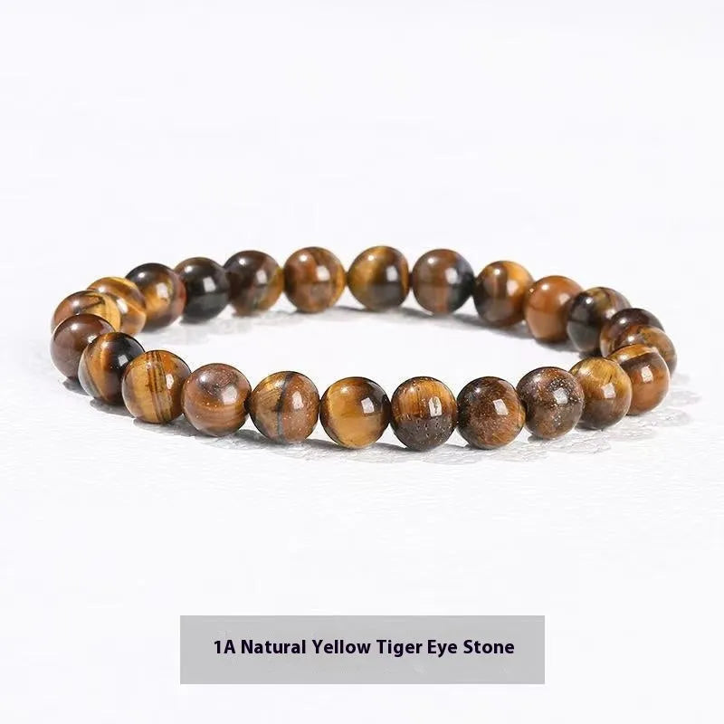 Natural tigereye crystal bracelet with yellow tiger eye beads approximately 8mm diameter on elastic cord
