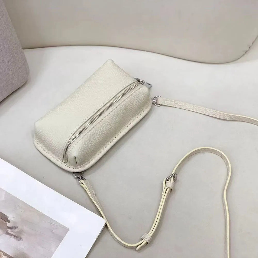 Women's mini crossbody bag in solid colour top grain leather with patchwork detail, horizontal square shape, retractable handle