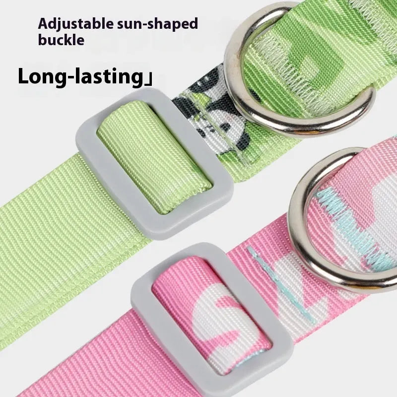 Adjustable nylon dog collar with blue to green gradient cartoon print and plastic buckle on a white background.