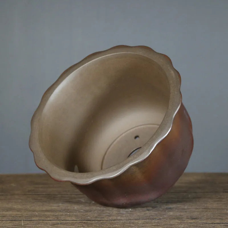Indoor antique carved ceramic flowerpot in purple sand with a wood-burning finish, shown in large size.
