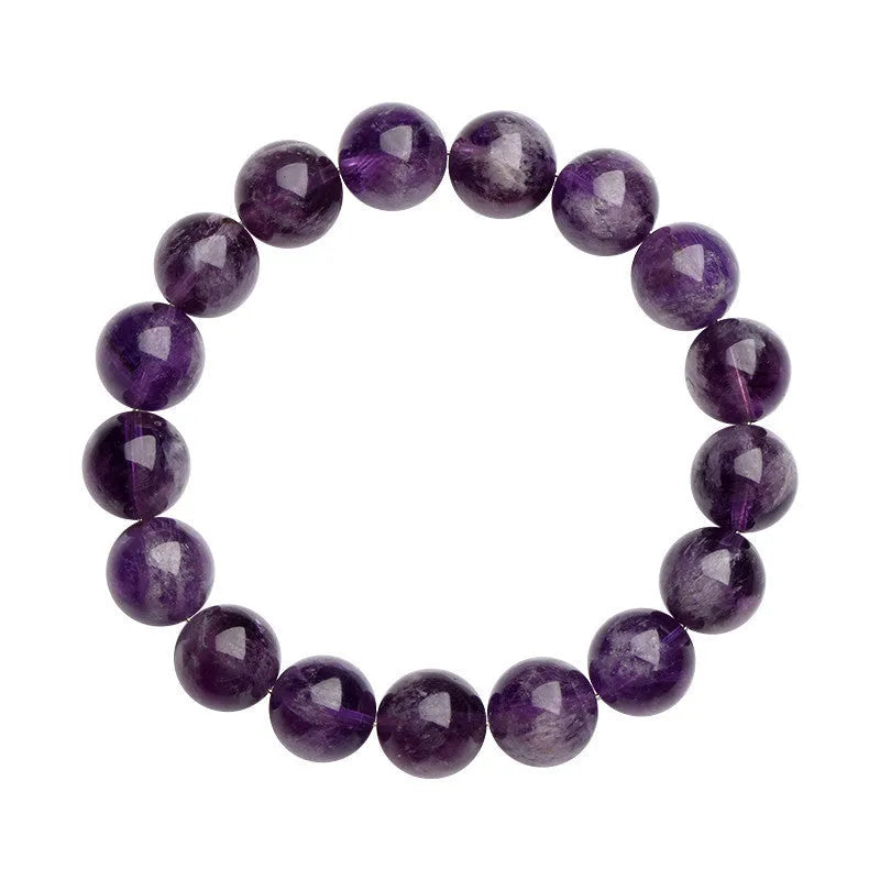 Natural feather amethyst bracelet with geometric Ruyi beads in snow mountain purple colour on a wrist.