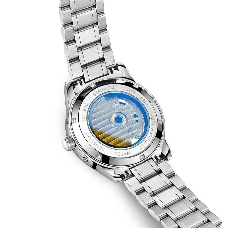 Men's stainless steel mechanical watch with a leather strap and sapphire crystal glass on a wrist.