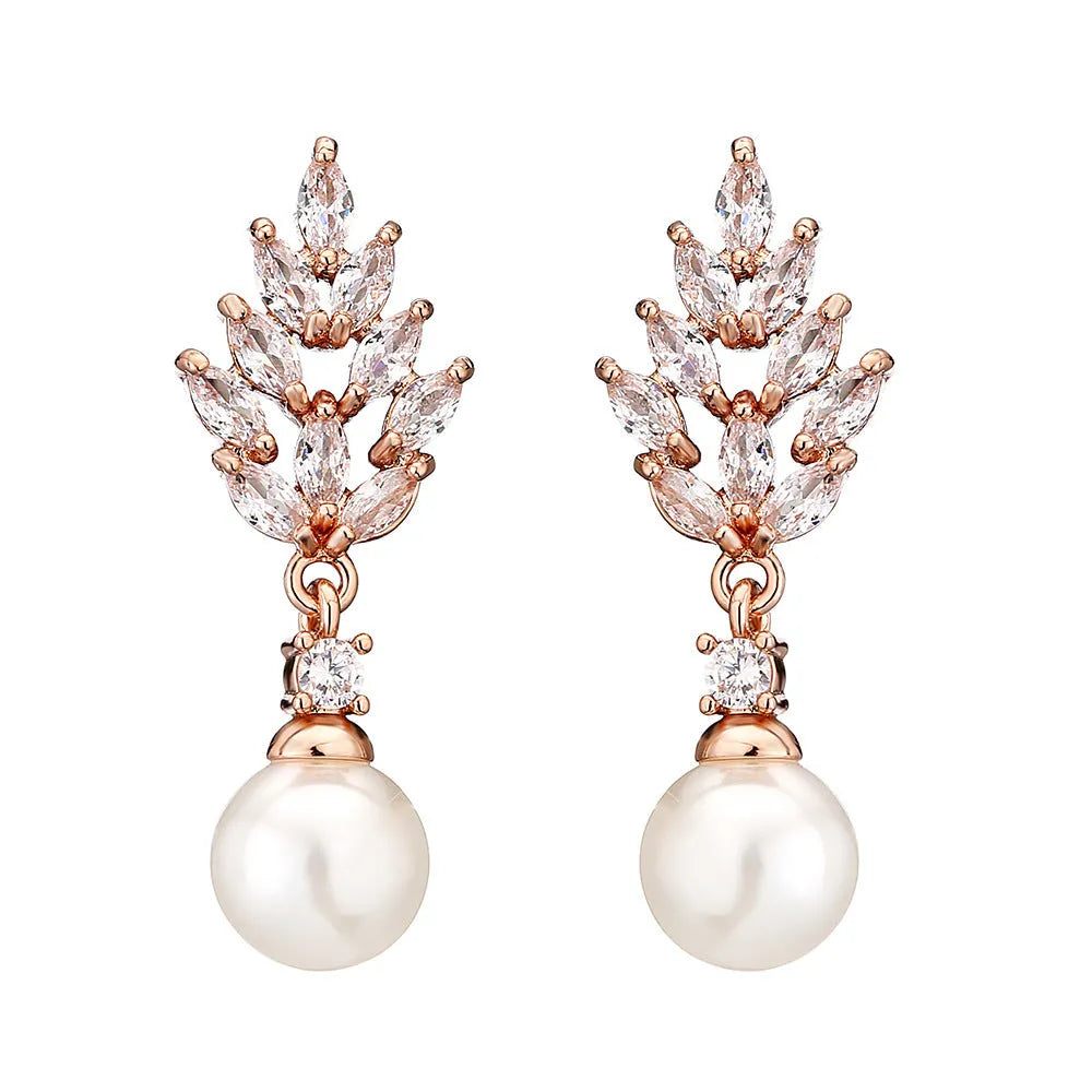Gold plated geometric earrings with micro inlaid zircon stones in a floral design.