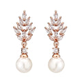 Gold plated geometric earrings with micro inlaid zircon stones in a floral design.