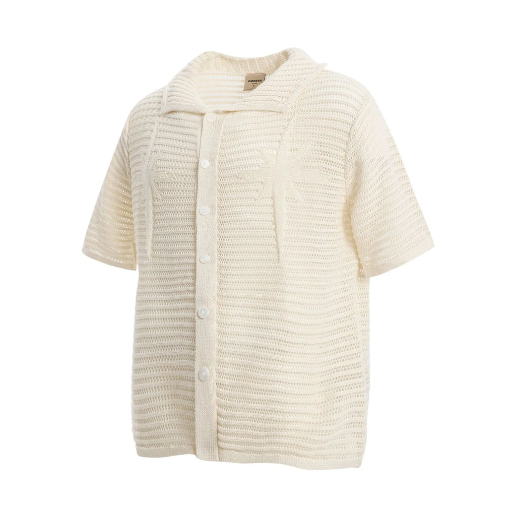 American retro loose short sleeve cotton shirt in apricot colour on a hanger.