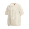 American retro loose short sleeve cotton shirt in apricot colour on a hanger.