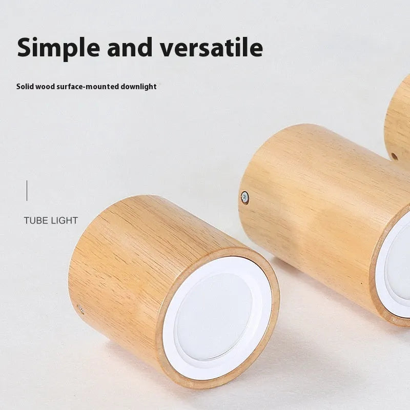 Modern solid wood surface mounted downlight in square and round shapes, shown in a wood colour finish.