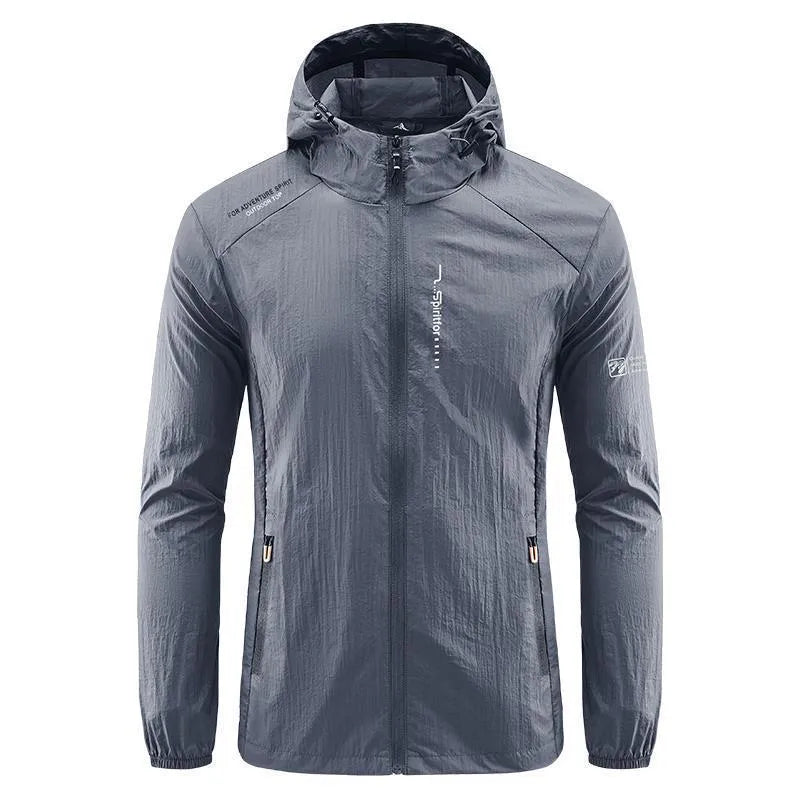 Man wearing a loose-fit light grey hooded nylon jacket for summer sun protection.