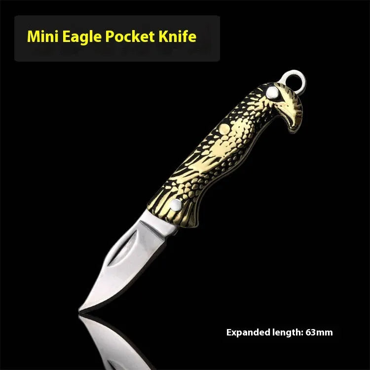 Brass mini folding knife keychain pendant with 3cm blade open showing brass body and compact size