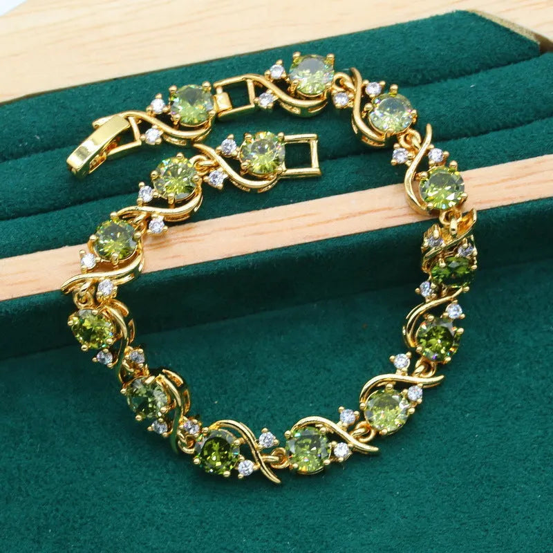 Complete zircon jewellery suit with necklace, earrings, and ring on snake bones chain in olive green colour