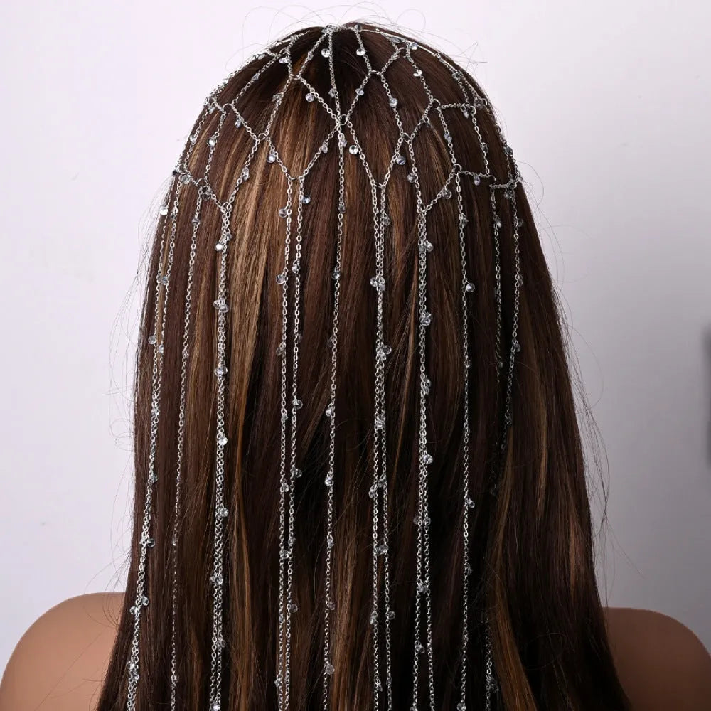 Gold electroplated rhinestone mesh headband with dangling tassel decorative elements