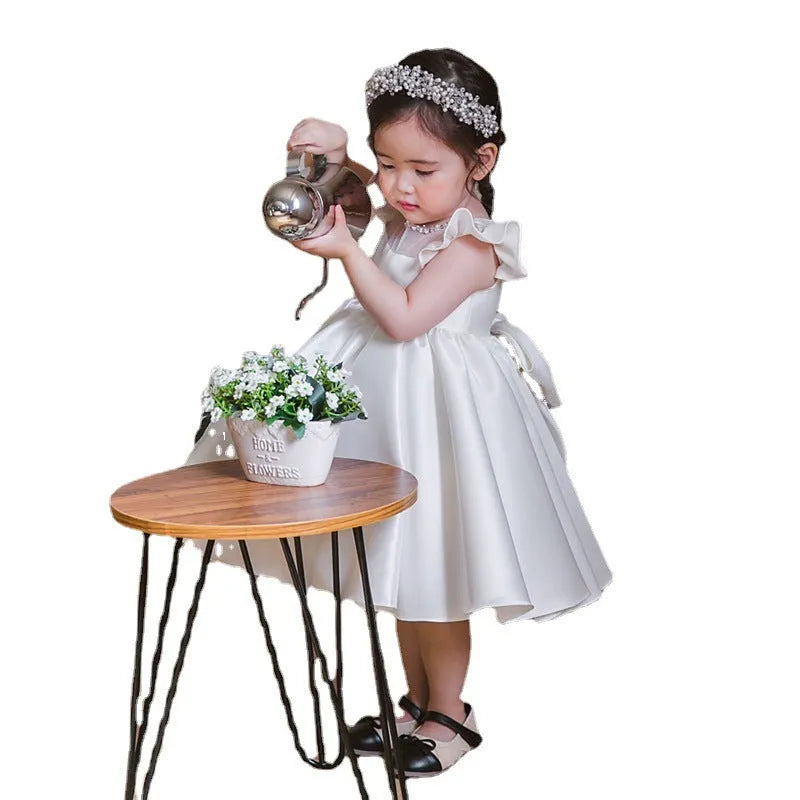 Girls' white satin princess dress with puff sleeves, full-length view, white fabric