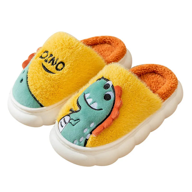 A pair of plush grey dinosaur slippers for indoor wear, showing soft cotton texture and graphic print.