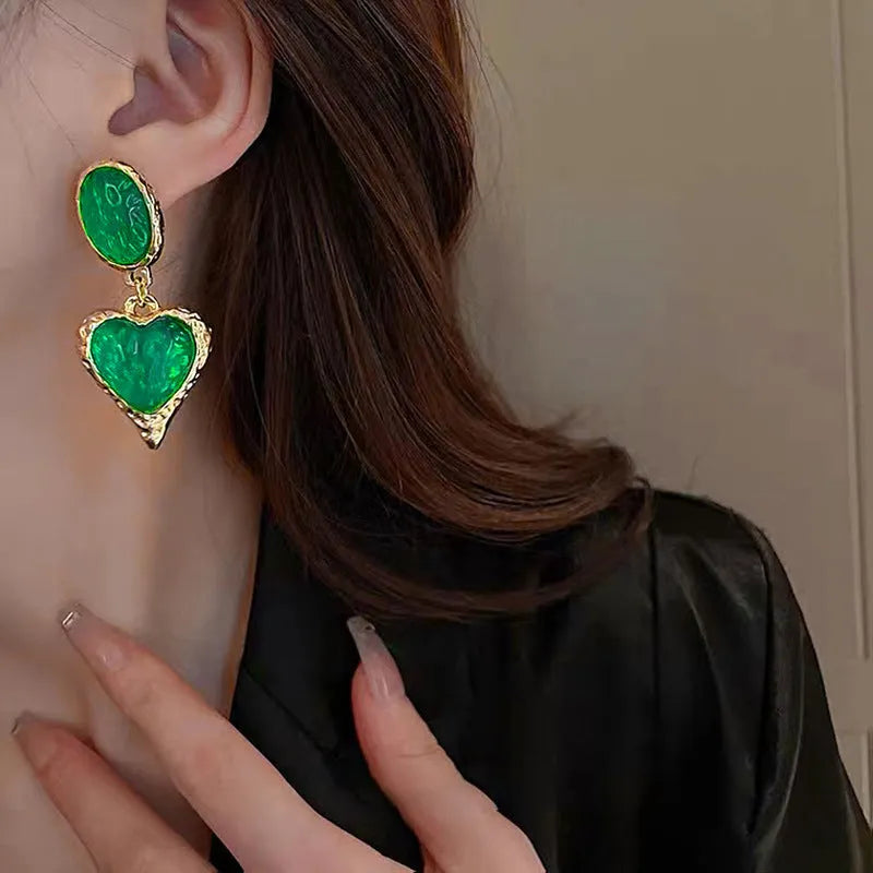 Silver pleated oval love heart stud earrings in purple, red, green, and yellow white colours.