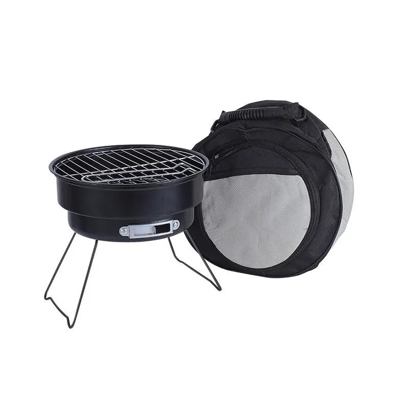 Small folding round outdoor ice stove and barbecue grill set with mesh, legs, and storage bag.