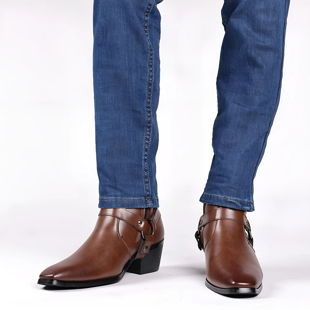 Black unisex ankle boots with side zipper, rivet details, and a high horseshoe heel on a grey background.