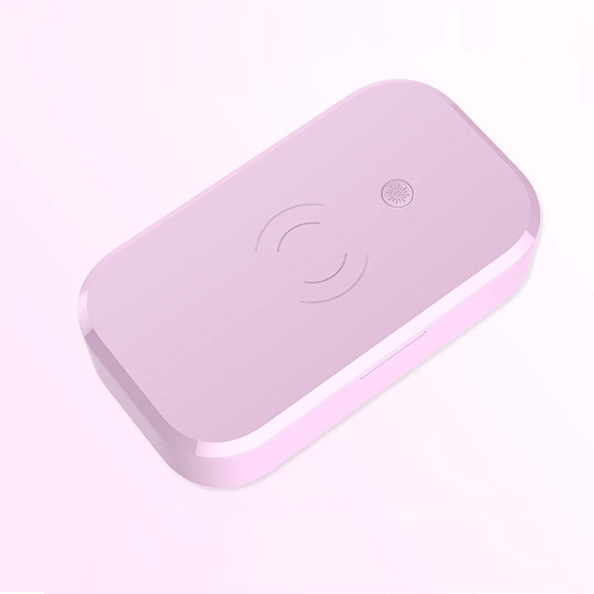 White multifunctional UV disinfection box with wireless charging pad for mobile phones and nail tools.