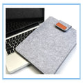 Khaki clamshell laptop clutch bag with frosted finish, open to show plush-lined interior and corner protector.