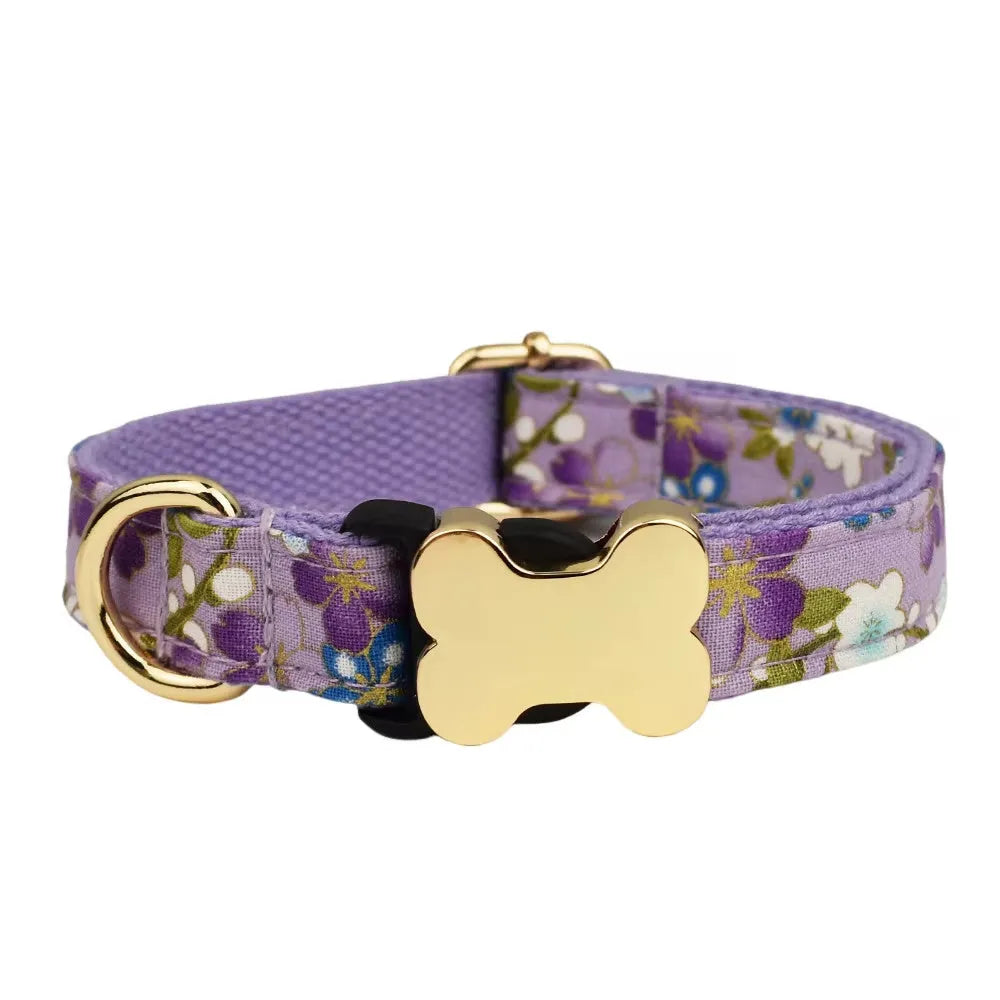 Flat nylon dog collar with a printed grid design and a bone-shaped metal buckle in assorted colours.