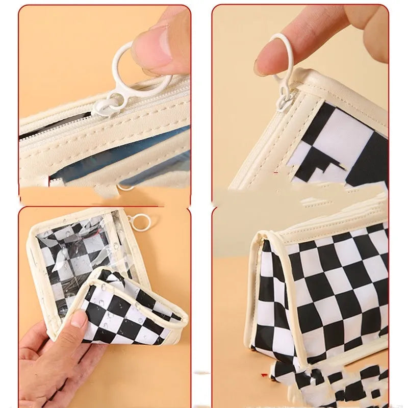 Transparent PVC pencil case with a chessboard pattern, showing pens inside.