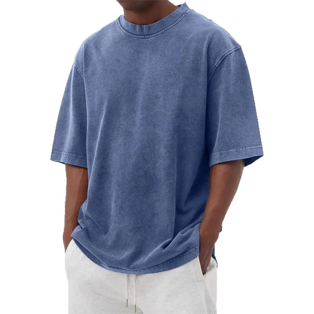 Men's stone-washed polyester t-shirt in loose fit with half sleeves and distressed finish