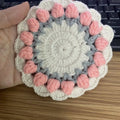 Handmade woven floral coaster in cotton and linen with hook design