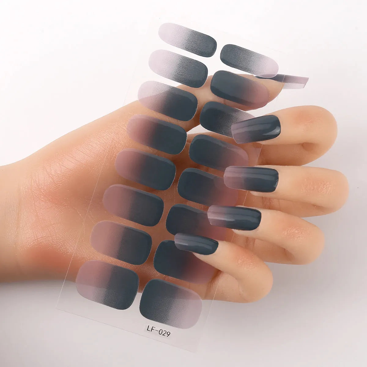 16 solid colour full nail art stickers with 22 patterns including cross, rose, butterfly designs in 12x6mm oval size