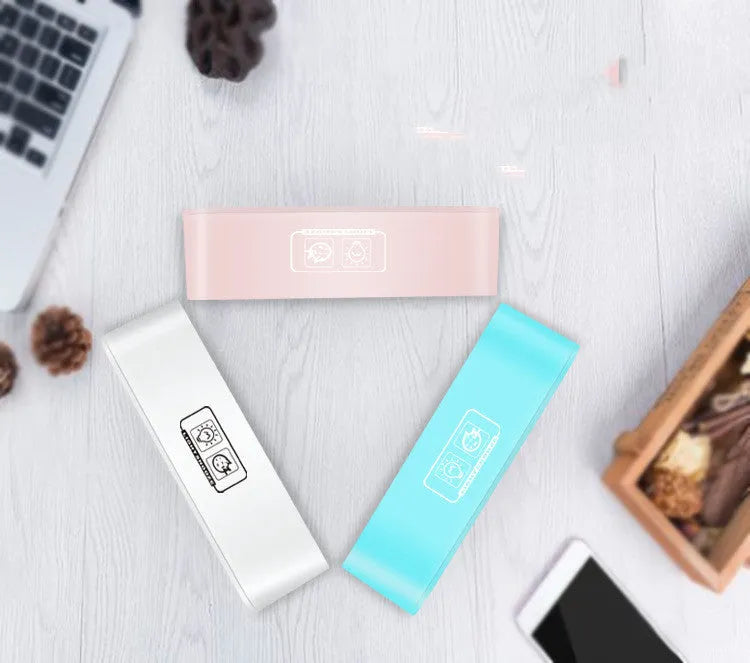 Rectangular blue and pink multifunctional LED atmosphere alarm clock with digital display and quartz glass mirror.