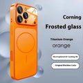 Frosted tempered glass magnetic phone case for iPhone on a table, shown in orange colour.