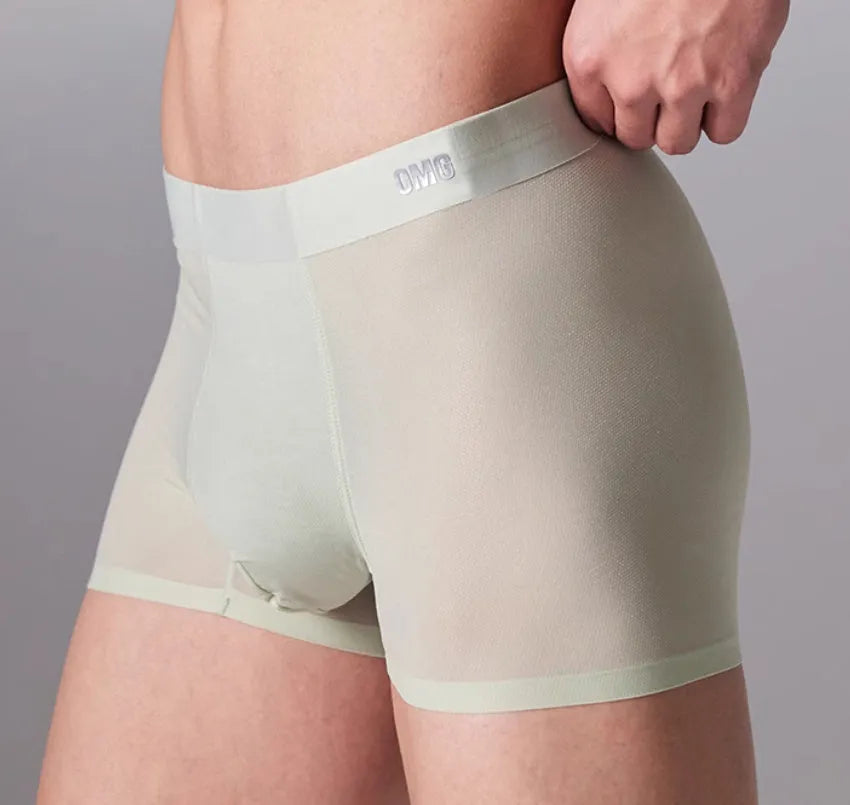 Seamless antibacterial fitness shorts in colours green, black, blue, and silver on a size chart.