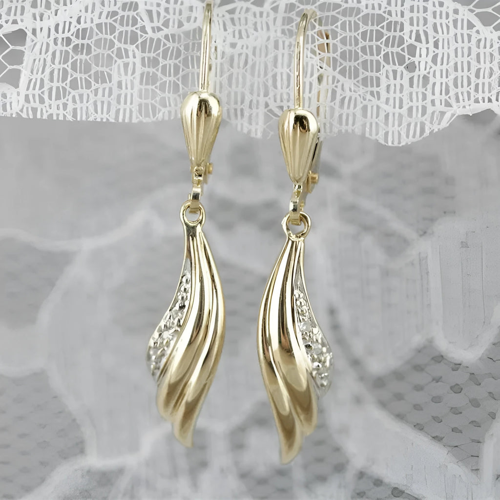 Heart shaped stud earrings in gold alloy with simple geometric design