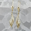 Heart shaped stud earrings in gold alloy with simple geometric design