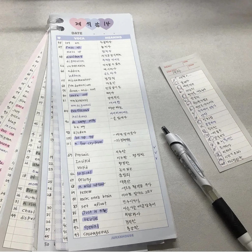 Half-B5 size vertical notepad with coloured cover, shown open to show lined pages.