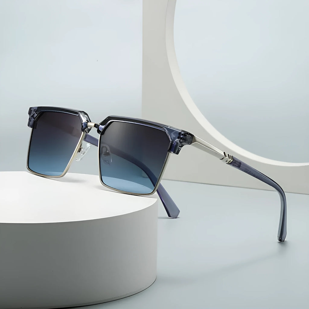 Men's square sunglasses with plastic frame and tinted UV400 lenses in a classic box style.