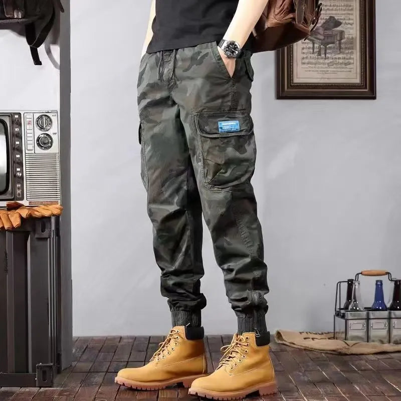 Men's camouflage cargo pants in Army Green, loose tapered fit with pockets, polyester cotton.