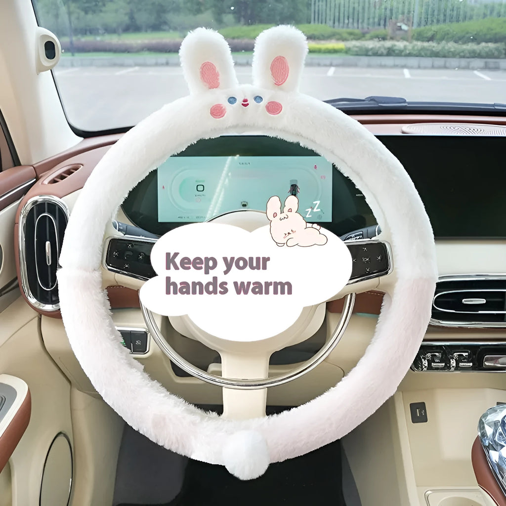 Plush furry steering wheel cover with embroidered panda face, fitted on a car steering wheel.