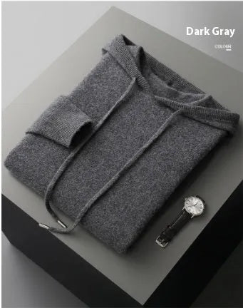 Men's dark grey cashmere hoodie and matching trousers laid out as a complete casual set.