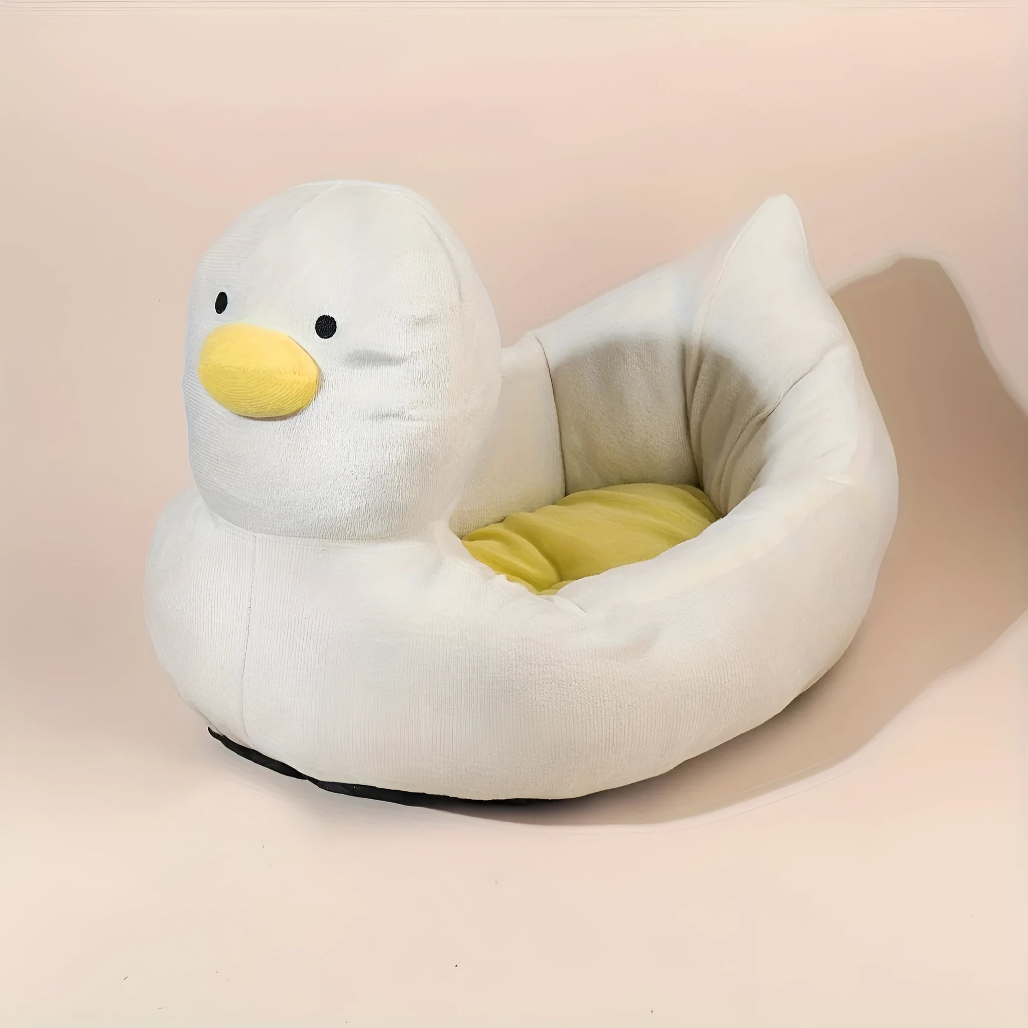 Blue duck-shaped fluffy pet bed sofa for small dogs and cats on a floor.