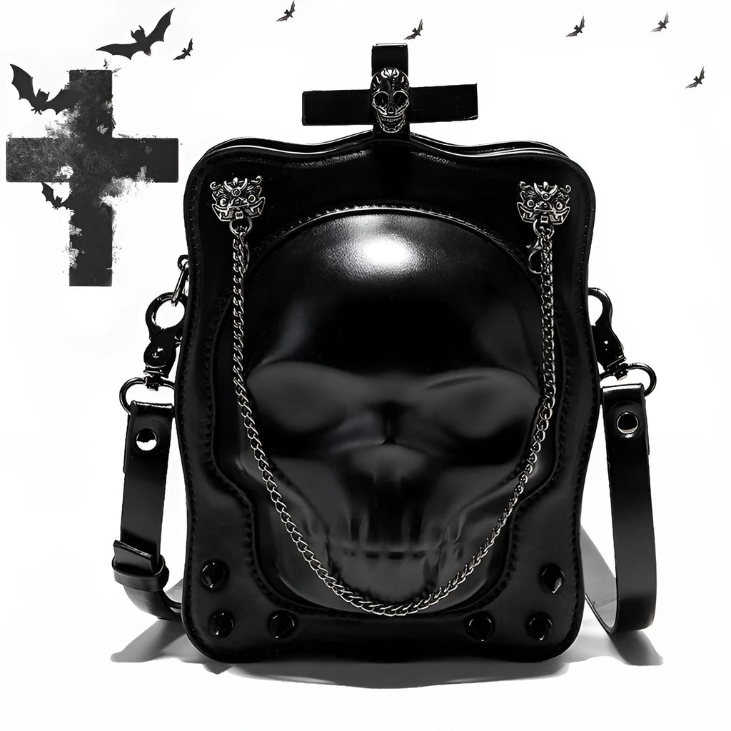 Black vertical square crossbody bag with embossed skull design, chain strap, and metal rivets.