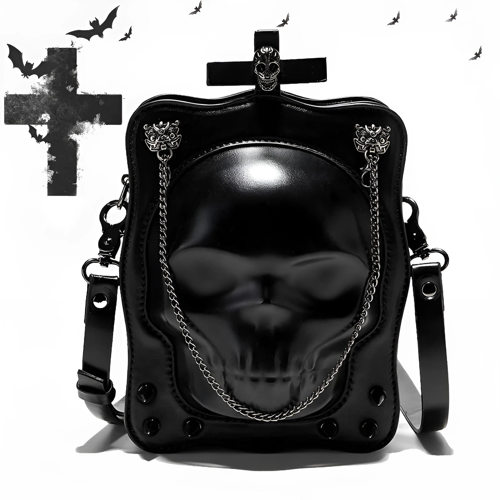 Black vertical square crossbody bag with embossed skull design, chain strap, and metal rivets.