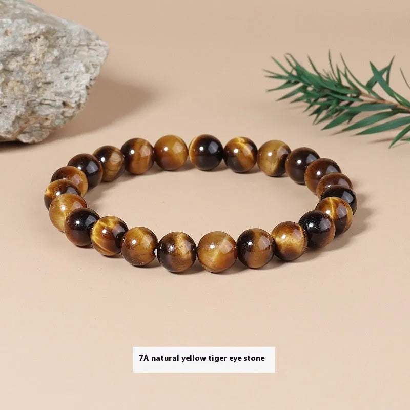 Natural tigereye crystal bracelet with yellow tiger eye beads approximately 8mm diameter on elastic cord