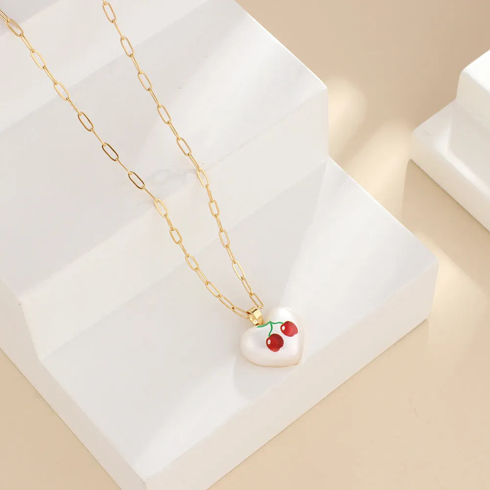 Adjustable necklace with heart charm and fruit pendant on 21-50cm chain